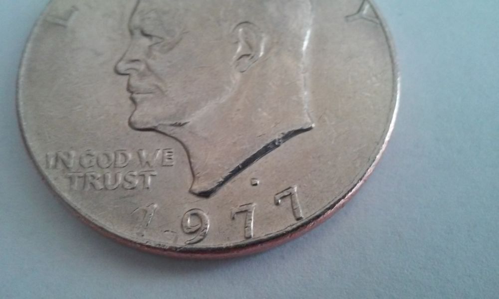 Help!-1977-D-Ike-Dollar-With-Smooth-Edge